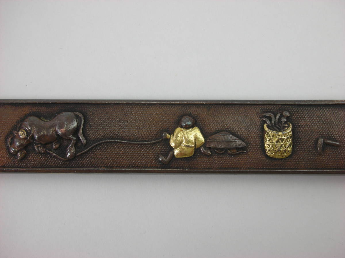 Kozuka Figure of a person pulling an old cow Petite Japan Antiques