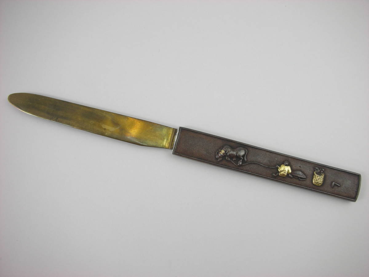 Kozuka Figure of a person pulling an old cow Petite Japan Antiques