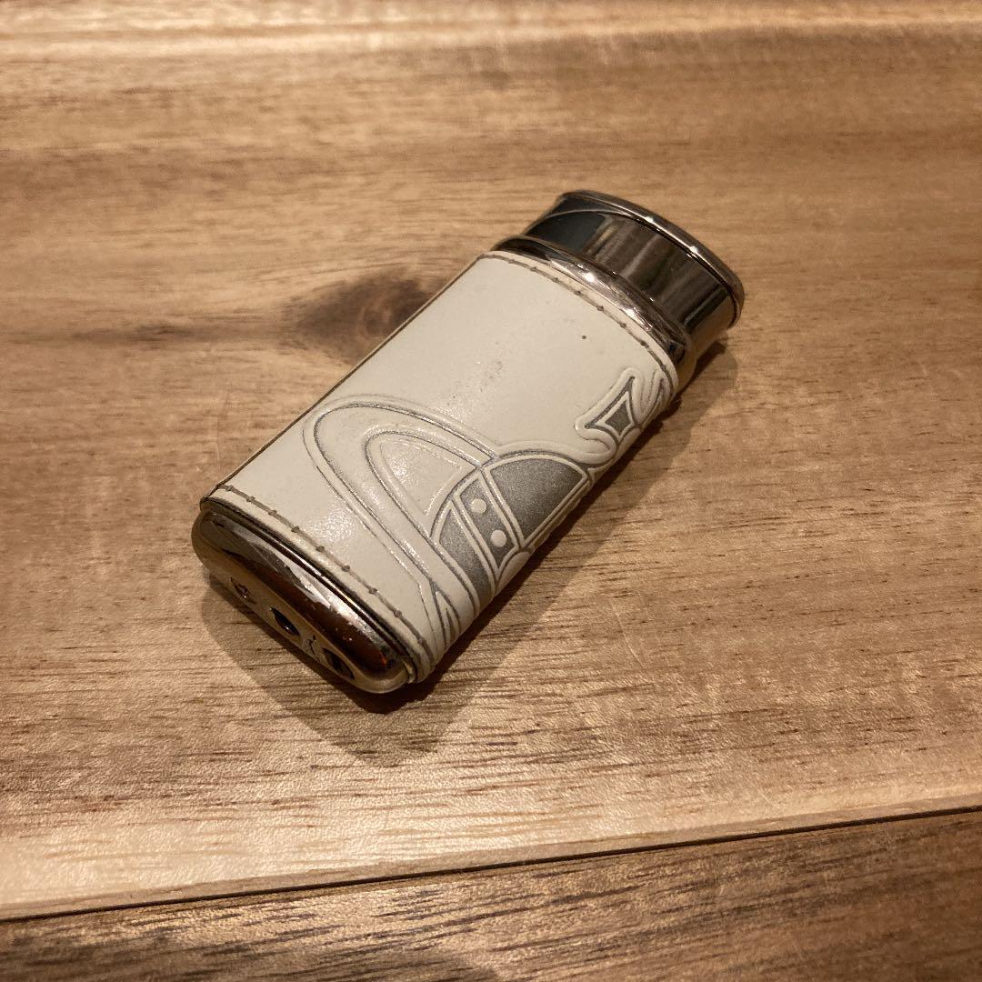 As is For Parts Vivienne Westwood Lighter  Leather color is white