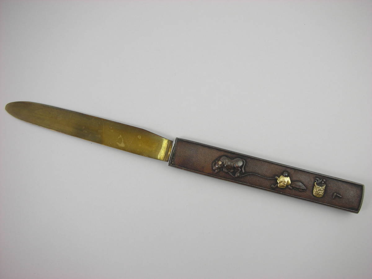 Kozuka Figure of a person pulling an old cow Petite Japan Antiques