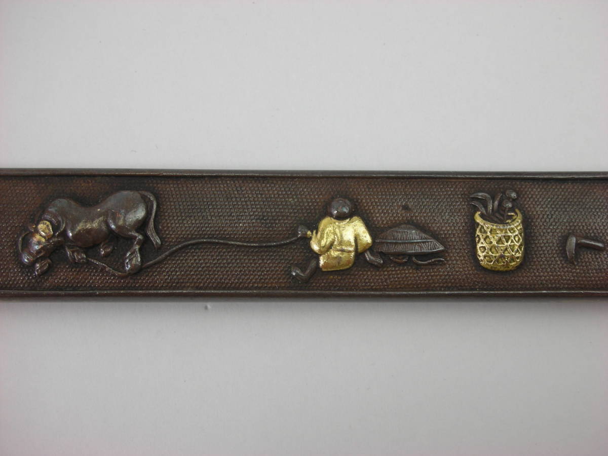 Kozuka Figure of a person pulling an old cow Petite Japan Antiques