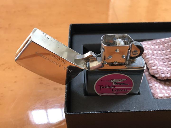 As is for parts zippo Twilight Express 10th anniversary with case 1999 unused