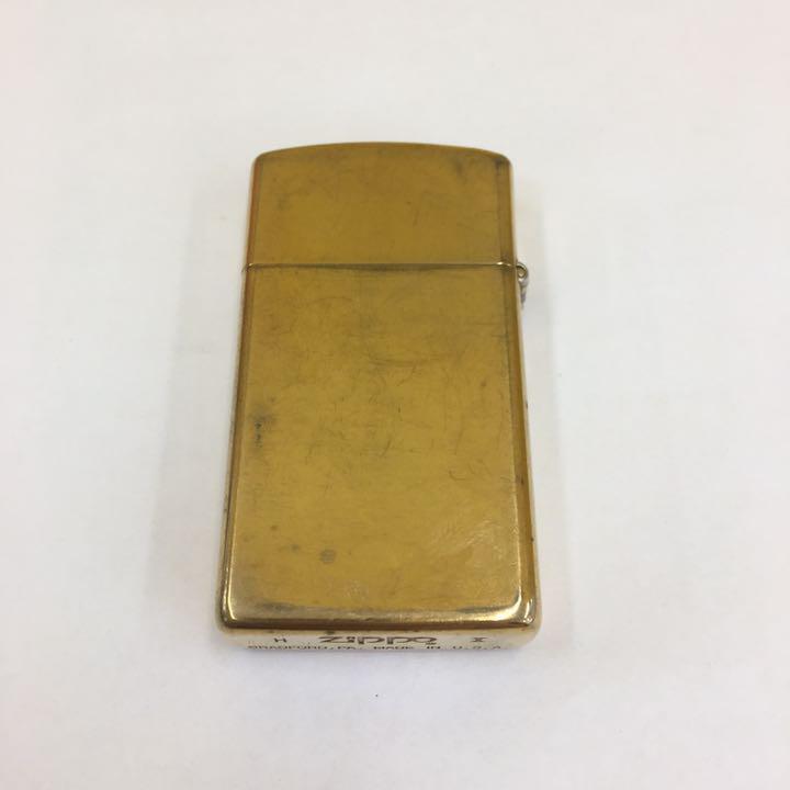 As is for parts ZIPPO lighter na-344.zippo SLIM ZIPPO SOLID BRASS made in 1994